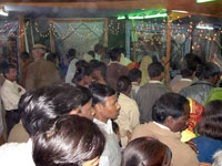 Inside gathering of pilgrims in exhibition Vasant Panchami