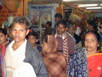 Inside gathering of pilgrims in exhibition during Makar Sankranti