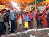 Local people watech live model of Ganga Avatran, inside the Ganga Exhibition