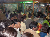 Inside gathering of pilgrims in exhibition Vasant Panchami