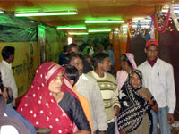 Inside gathering of pilgrims in exhibition Mauni Amavsya