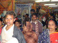 Inside gathering of pilgrims in exhibition during Makar Sankranti